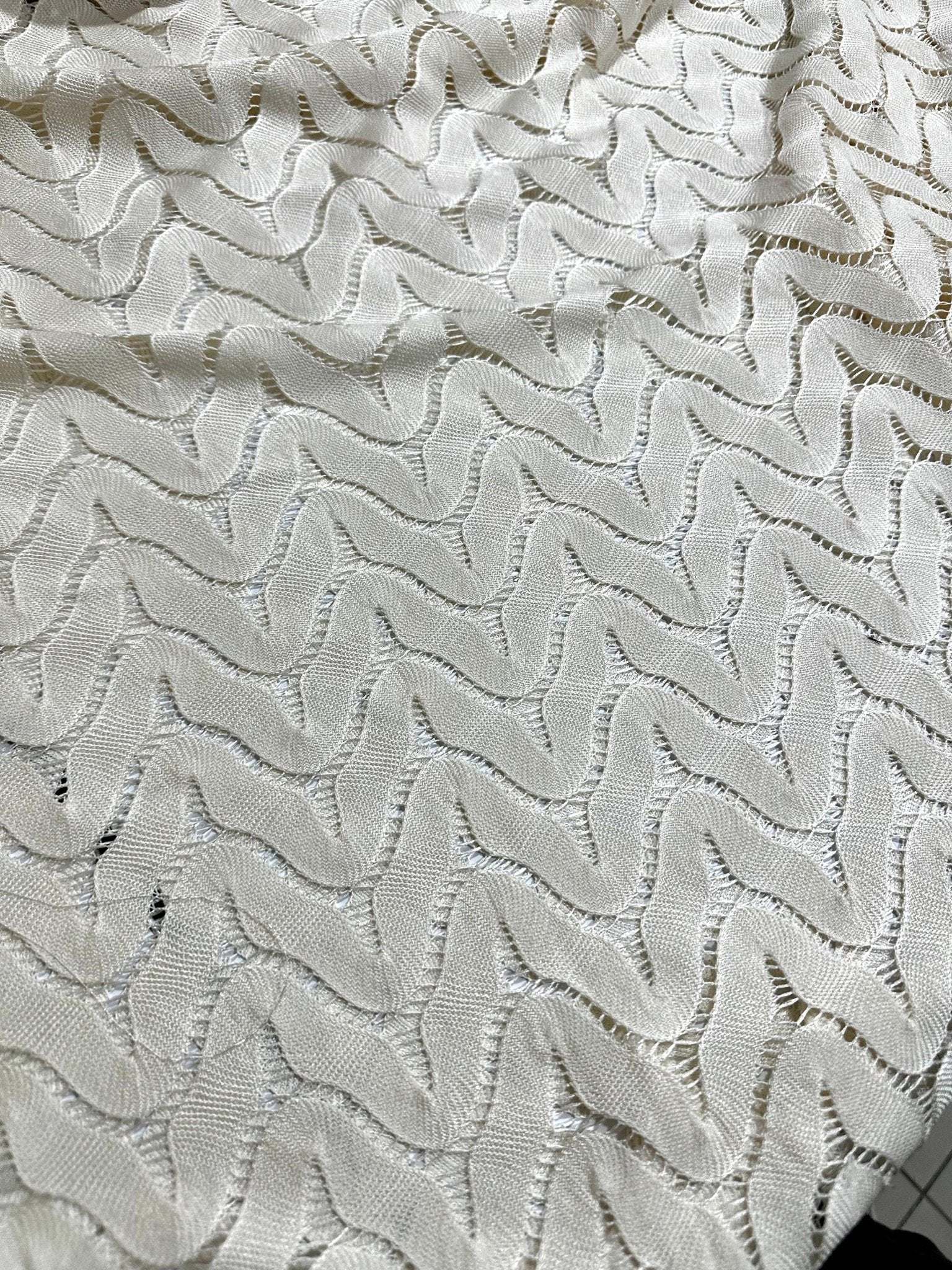 Off-White zigzag knit jersey fabric in breathable mesh with modern pattern and soft texture