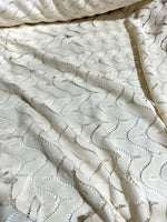 Off-White zigzag knit jersey fabric in breathable mesh with a modern pattern and soft texture.