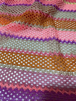 pink striped knit jersey fabric with mesh texture and vibrant horizontal stripes