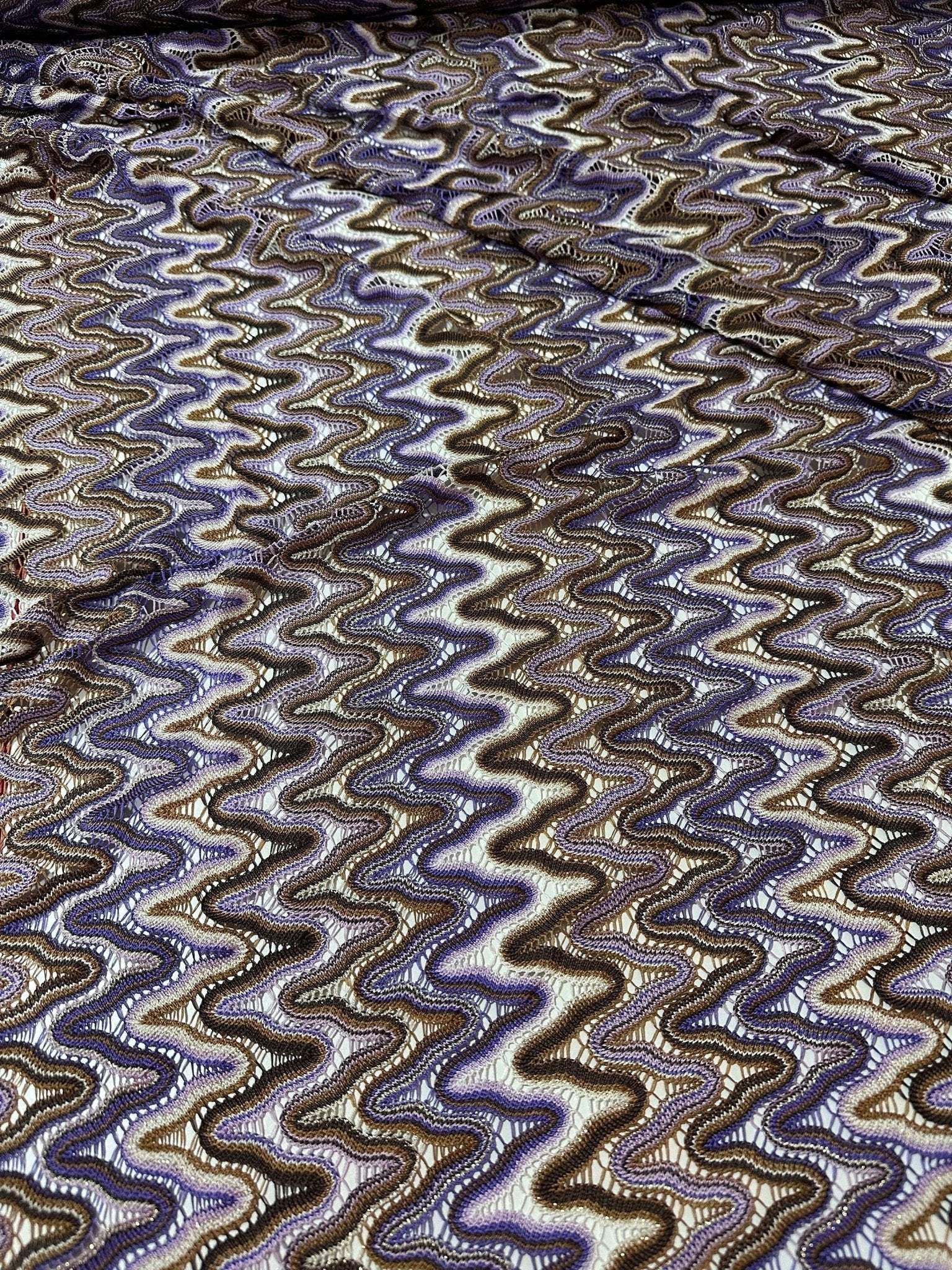 Purple brown zigzag knit jersey mesh fabric with wavy pattern for versatile sewing projects