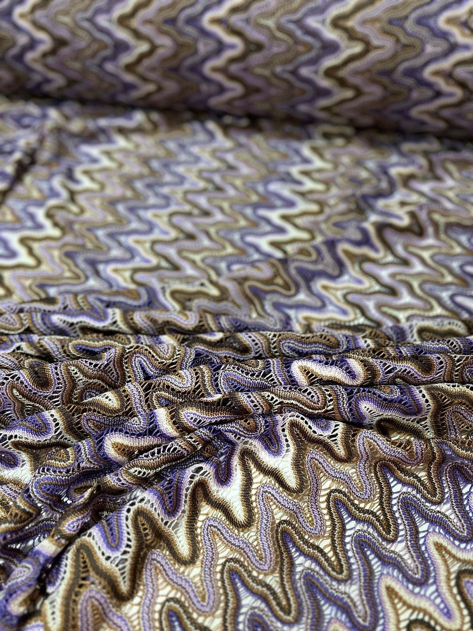 Purple and brown zigzag knit jersey mesh fabric with wavy pattern for sewing projects
