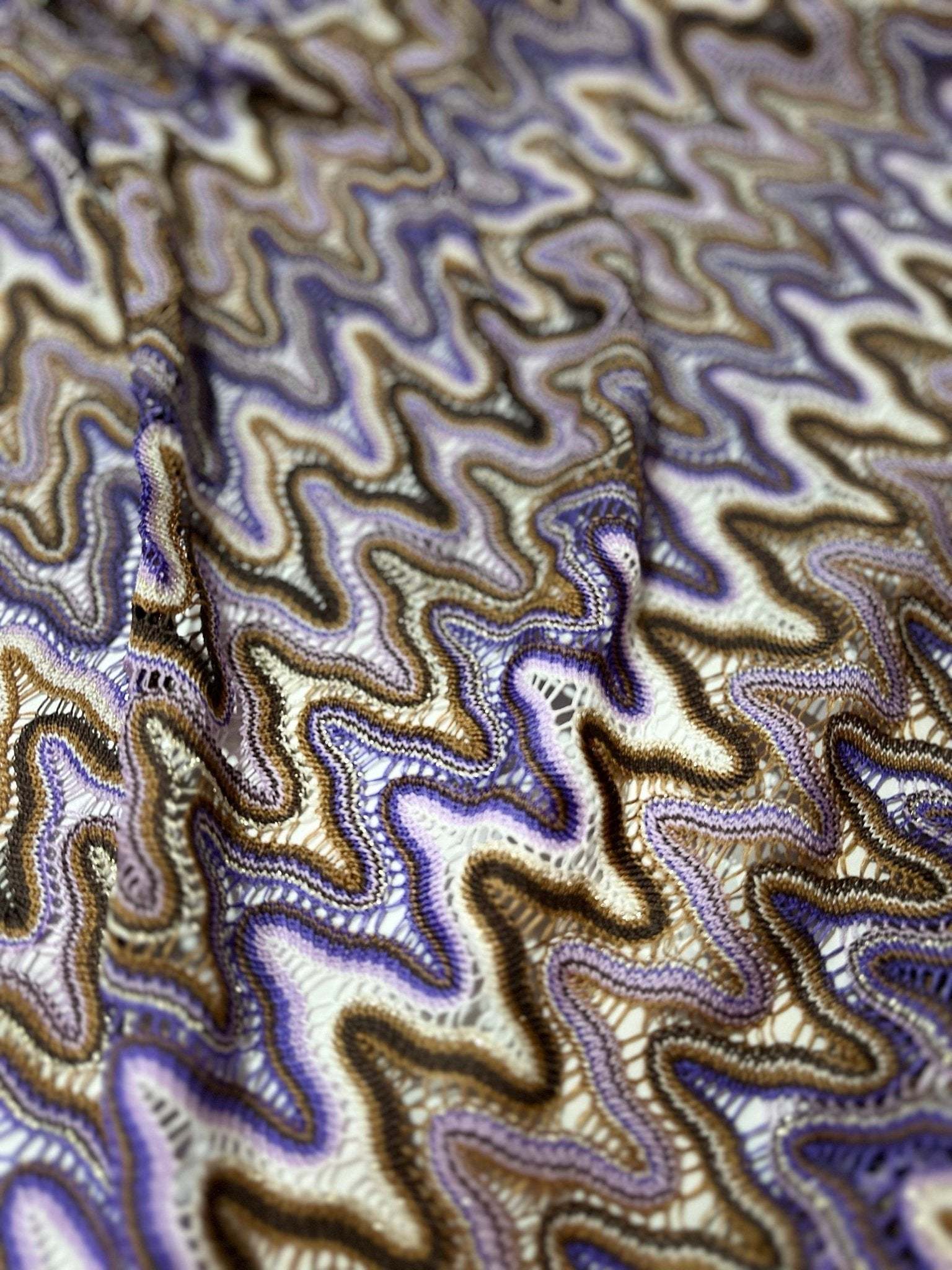 Purple brown zigzag knit jersey mesh fabric with textured pattern and soft drape for sewing projects