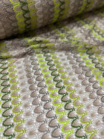 Beige green zigzag knit jersey mesh fabric with soft stretchy texture for clothing and crafts