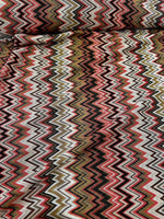 Coral zigzag knit jersey fabric with luxury mesh Italian design in coral, white, black, and olive tones