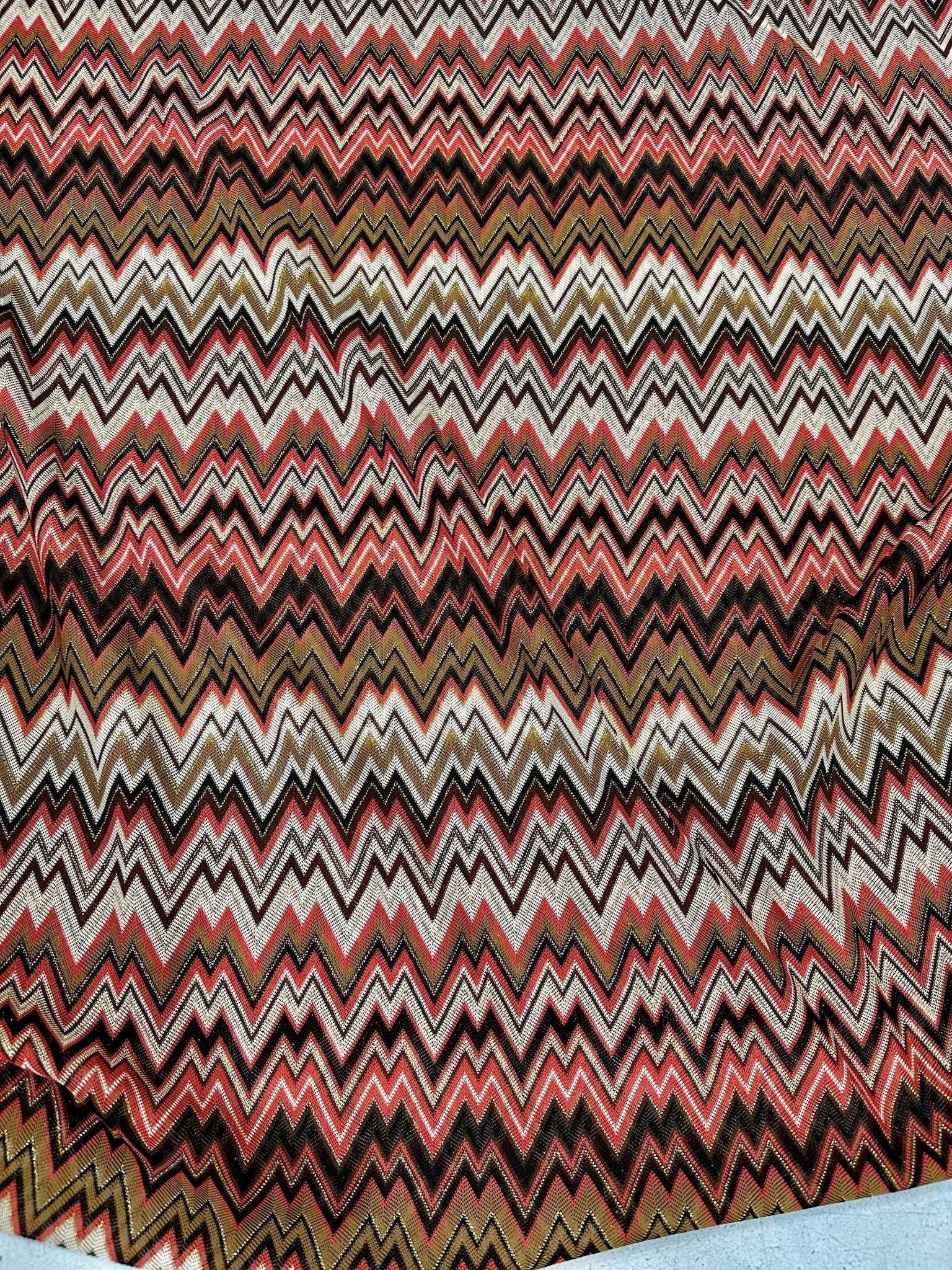 Coral zigzag knit jersey fabric with luxury mesh Italian design in coral, black, white, and gold tones