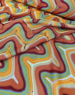 Zigzag knit jersey mesh fabric with multicolor wavy pattern and soft texture for fashion garments
