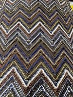 Shimmering zigzag knitted mesh fabric with multicolor chevron pattern and stretchy elastic texture
