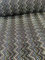 Shimmering zigzag knitted mesh fabric with elastic stretch and multicolor pattern for stylish garments