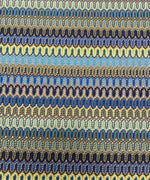 Zigzag pattern mesh fabric in yellow and blue with a wavy textured design for crafting and fashion projects