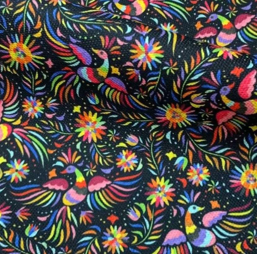 Black Otomi pattern upholstery fabric with colorful birds and floral designs