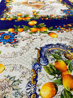 Floral mosaic lemon angel pattern fabric with vibrant yellow lemons, blue decorative borders, and intricate floral designs on a textured background