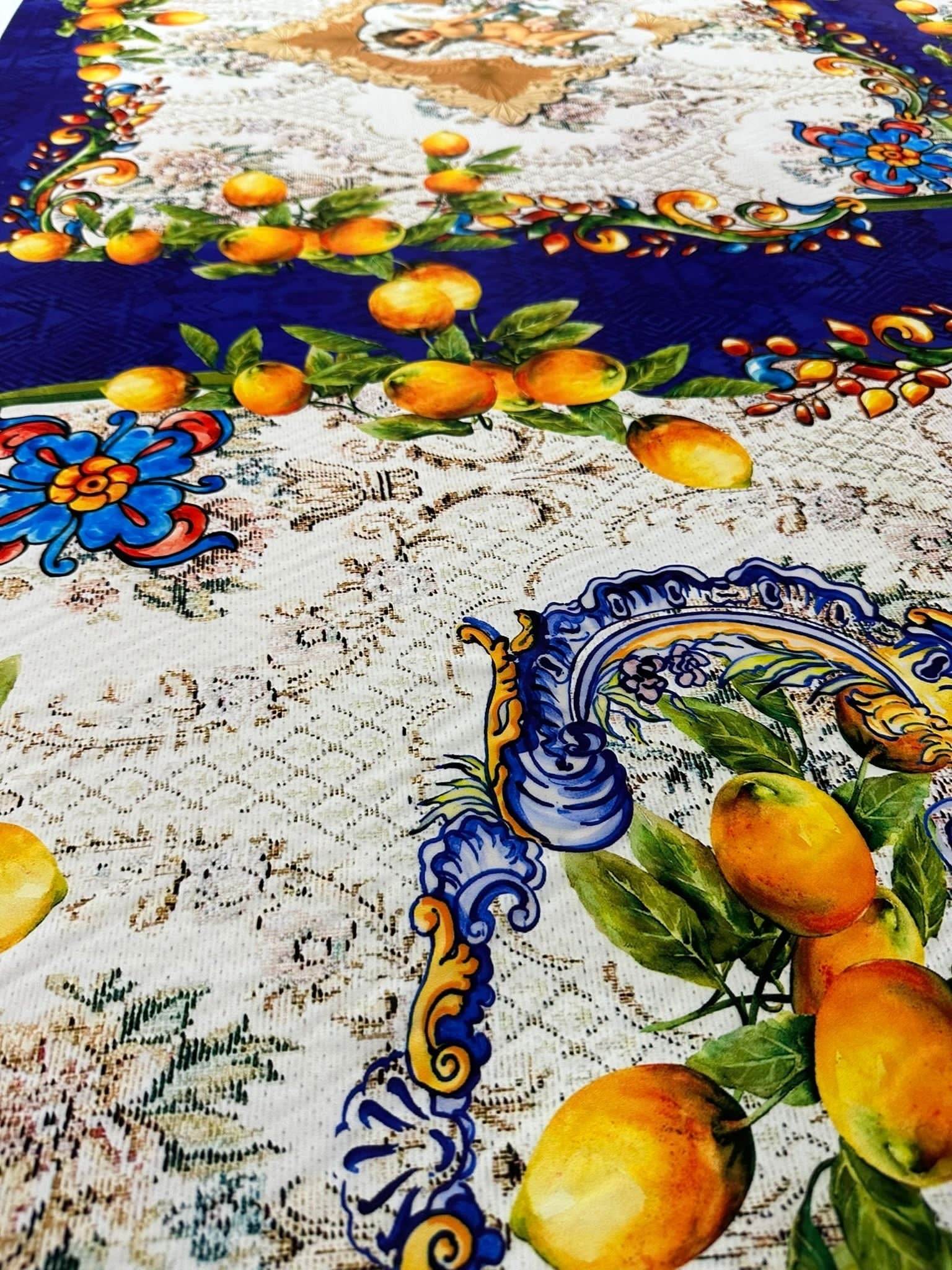 Floral mosaic lemon angel pattern fabric with vibrant yellow lemons, blue decorative borders, and intricate floral designs on a textured background