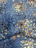 Blue fabric with multicolor confetti dot pattern