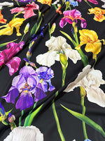 Floral Crepe Fabric with vibrant iris flowers on a black background, lightweight and soft texture for sewing projects