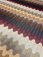close-up of multicolor pleated wave fabric with zigzag knit pattern in earthy tones