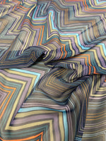 Multicolor zigzag patterned fabric with vibrant geometric design and 150cm width for sewing and crafting projects