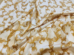 white fabric with gold baroque pattern for dresswear