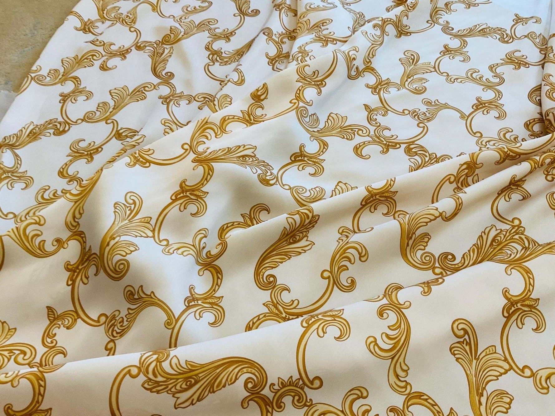 High-quality navy blue fabric with elegant gold Baroque pattern for dresswear