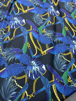 Navy blue fabric with leaf and gold chain pattern, suitable for apparel and home decor projects