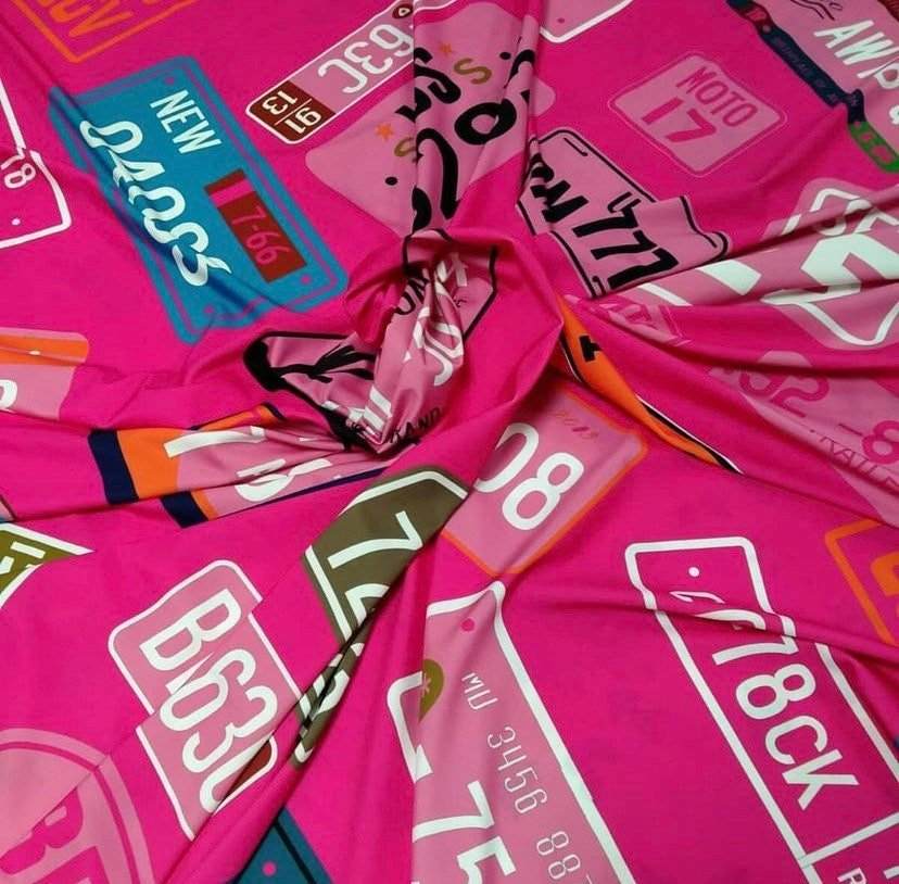 Pink fabric with colorful number plate pattern for sewing and quilting crafts
