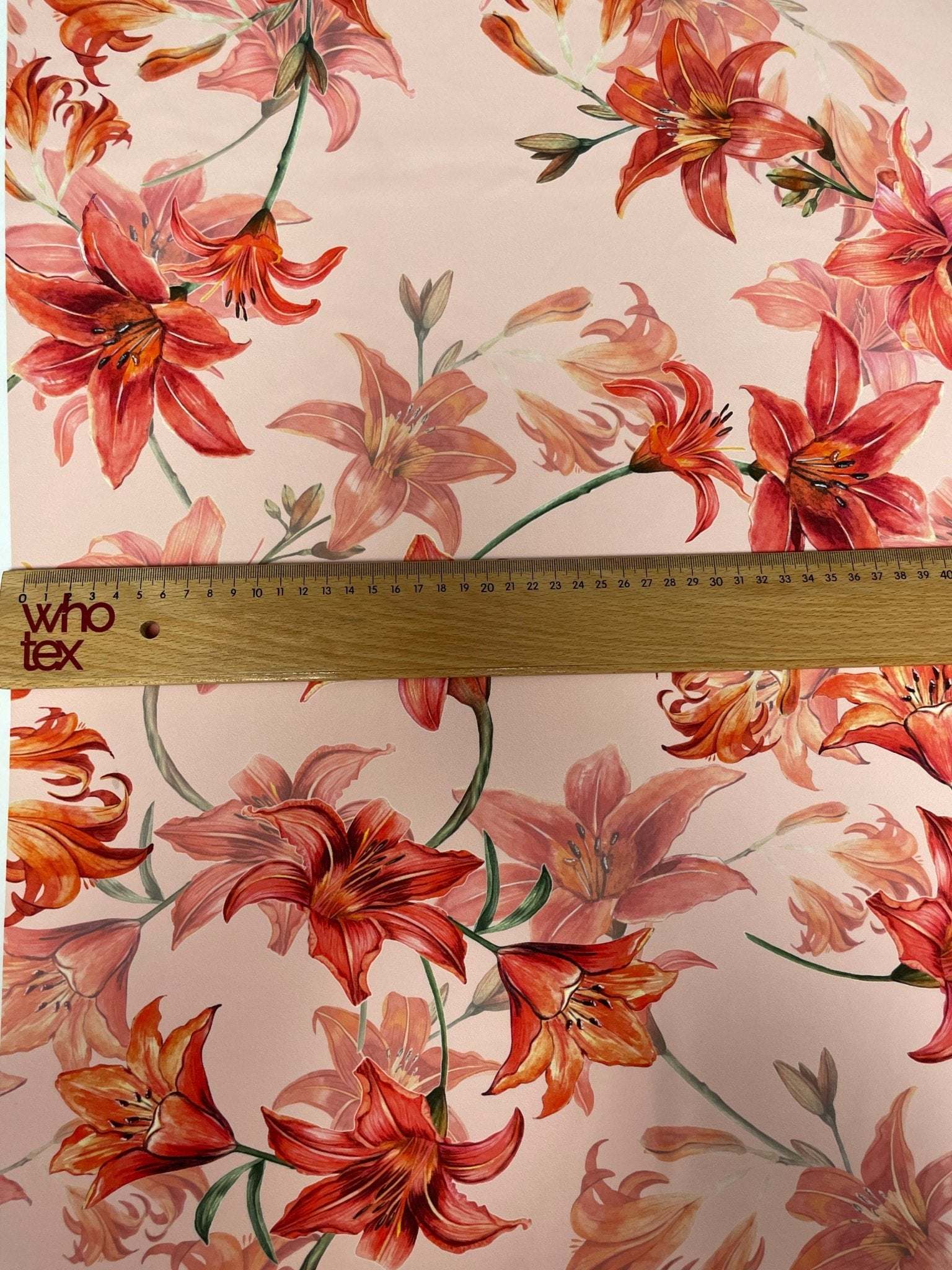Orange and red lily floral fabric with soft texture and 150cm width for sewing and crafting projects