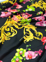 Orchid Baroque floral fabric with vibrant pink and green orchids and intricate yellow baroque patterns on black background