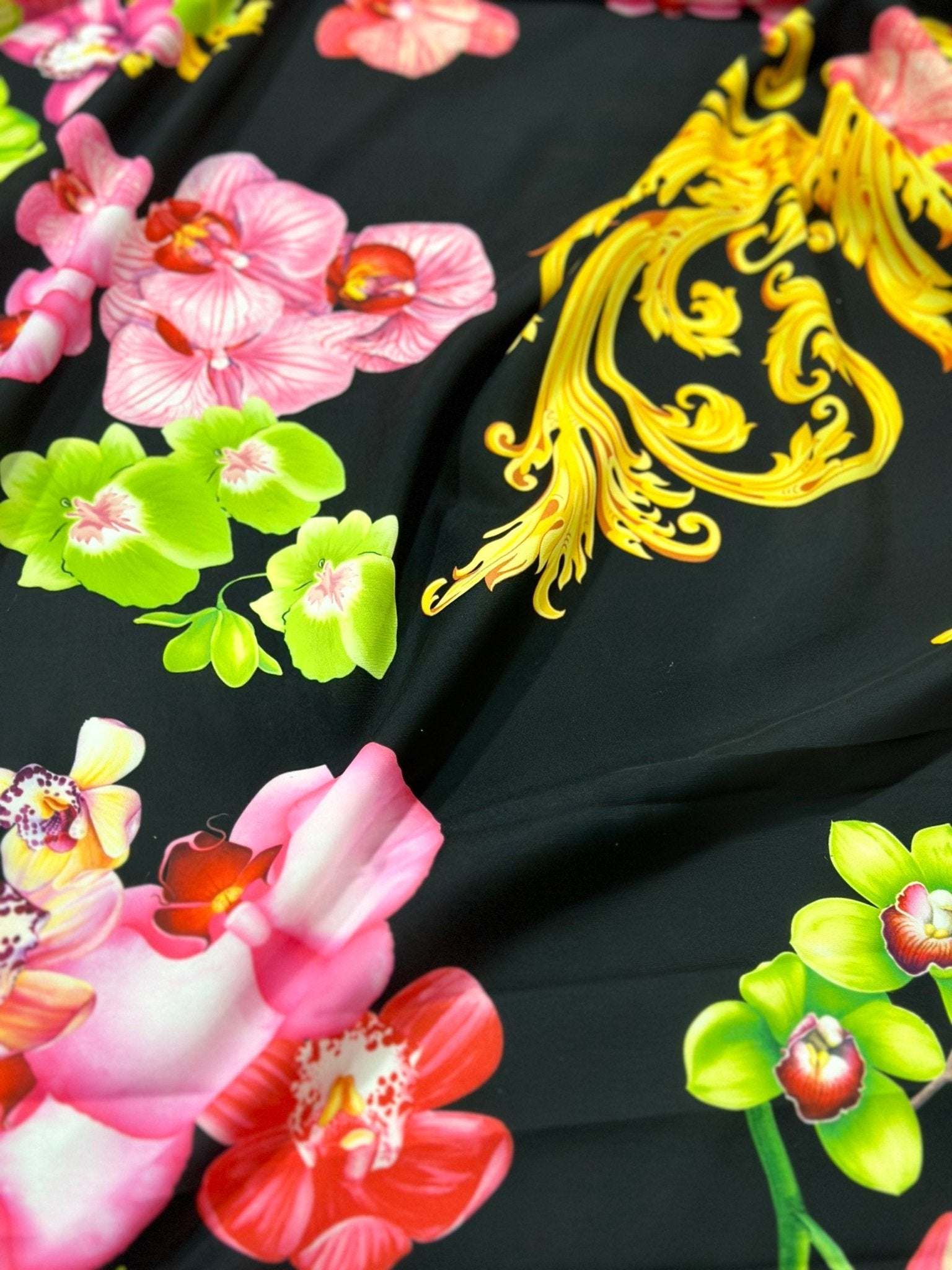 Orchid Baroque Floral Fabric with vibrant pink, green orchids and intricate yellow baroque patterns on black background