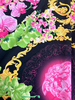 Orchid Floral Swirl Print fabric with vibrant pink orchids, green leaves, and intricate gold baroque swirls on a black background