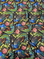 Peacock Rose Fabric with vibrant peacock and rose pattern on black cotton, ideal for sewing and home décor projects