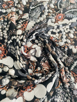 Black jewelry fabric with elegant pearl and gemstone pattern for stylish accessories