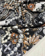 Black jewelry fabric with pearl and gold accessory pattern for elegant design