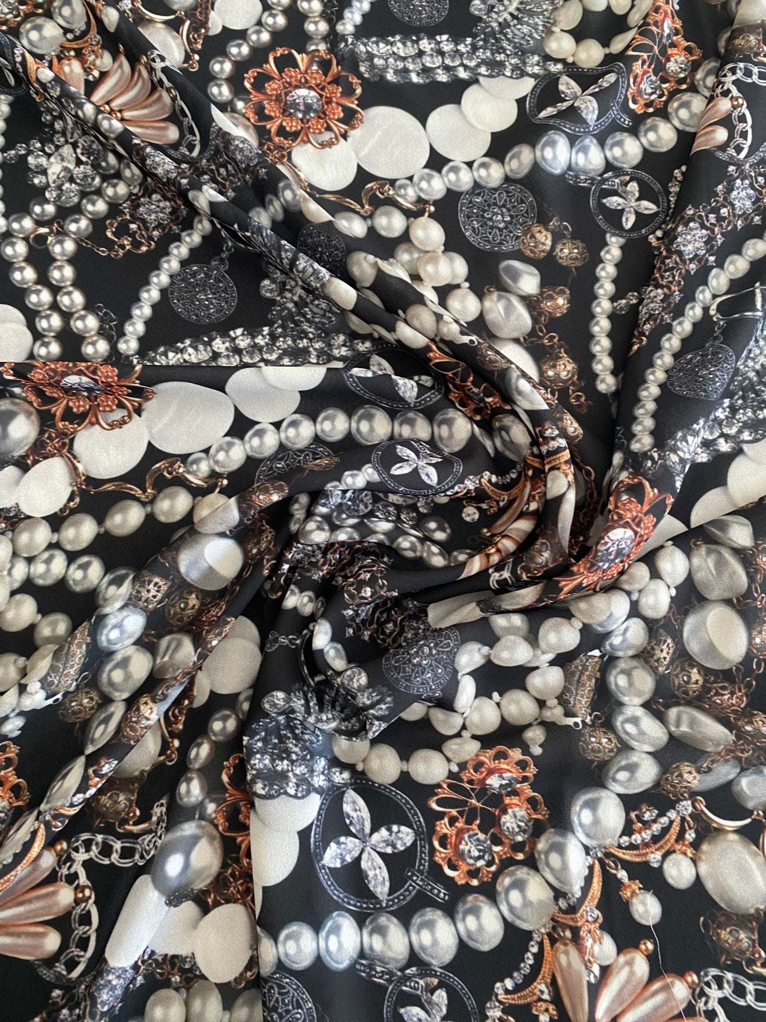 Black jewelry fabric with pearl and decorative patterns for elegant accessory crafting