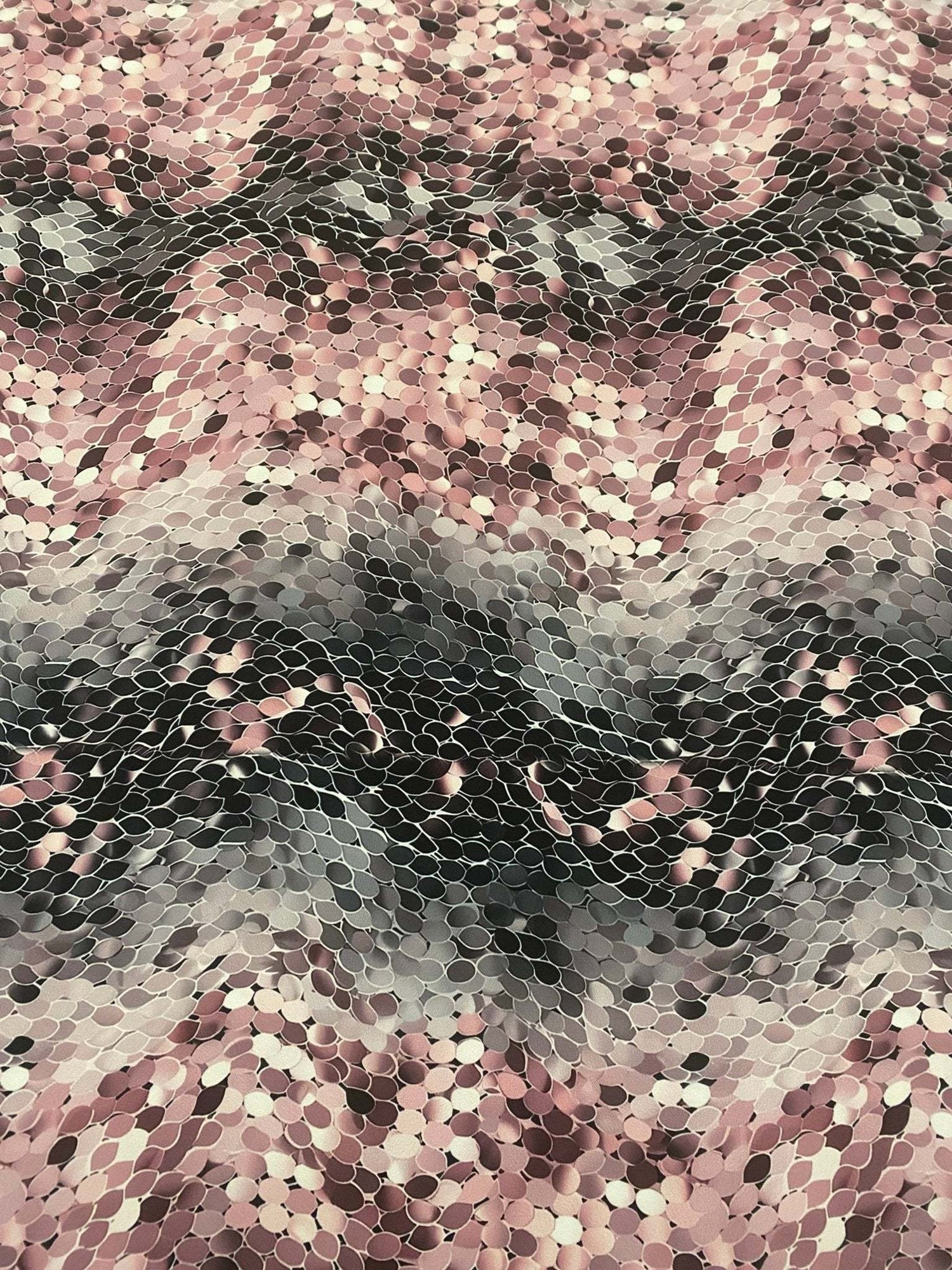 Pink and black abstract scales print fabric with textured optical illusion pattern, 150cm wide