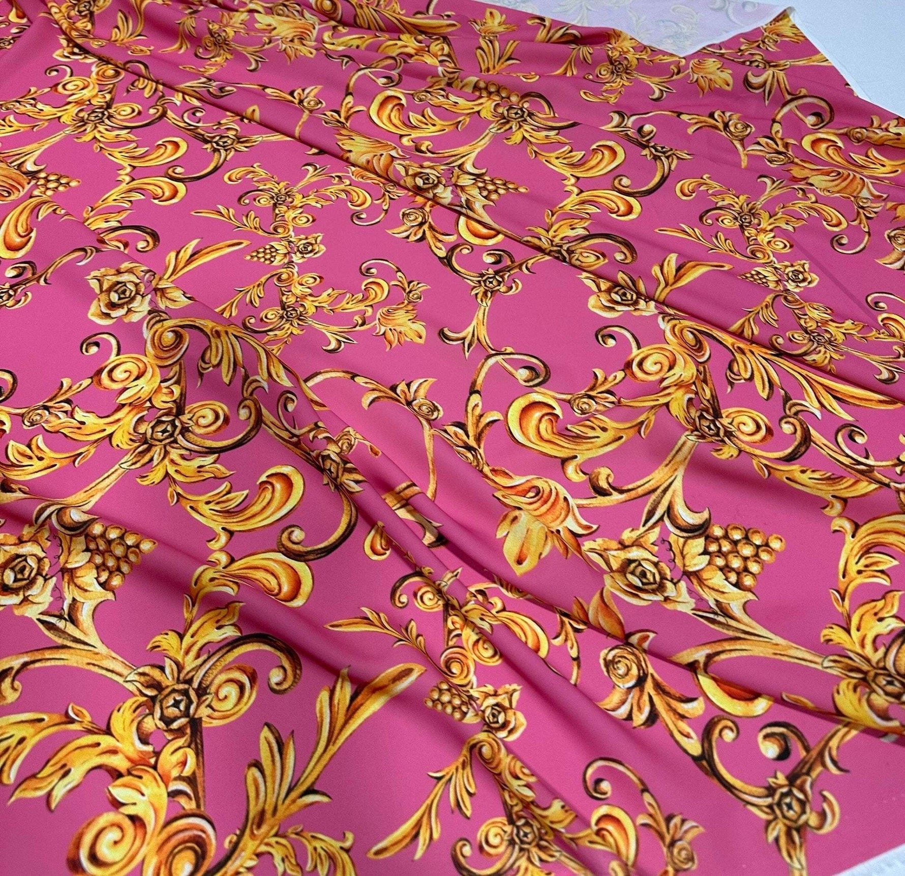 Pink and gold Baroque print fabric with ornate floral and scroll design, 150cm wide, ideal for upholstery and decorative projects