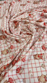 Pink plaid fabric with cute teddy bear and heart balloon print for crafting and sewing projects