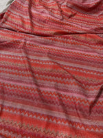 4-way stretch pink and red zigzag knit fabric with Lurex shimmer accents