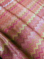 Pink zigzag knit Lurex fabric with shimmering threads and 4-way stretch for versatile activewear and costumes