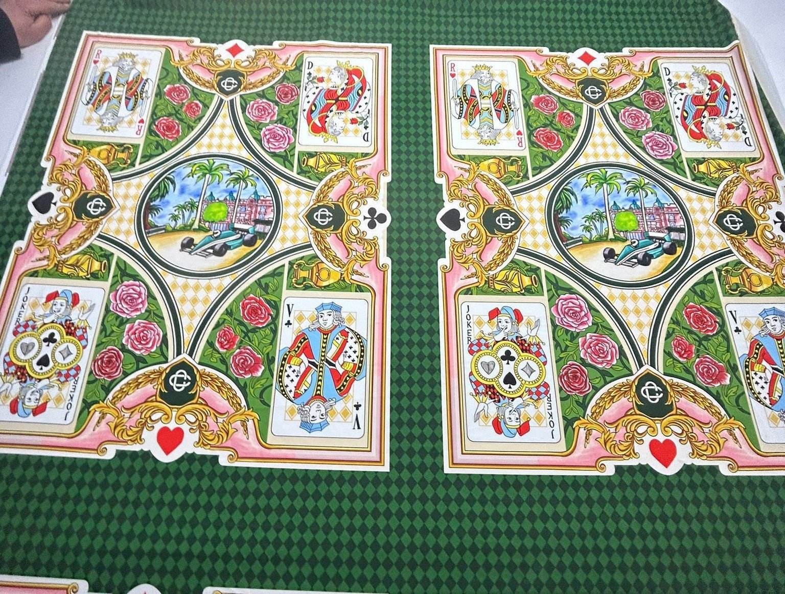 Silky crepe fabric with vibrant playing card design on green checkered background