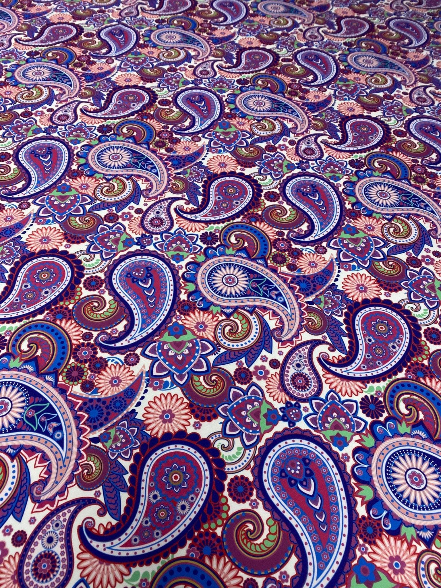 Purple paisley fabric with intricate floral and paisley digital print for upholstery and home decor projects