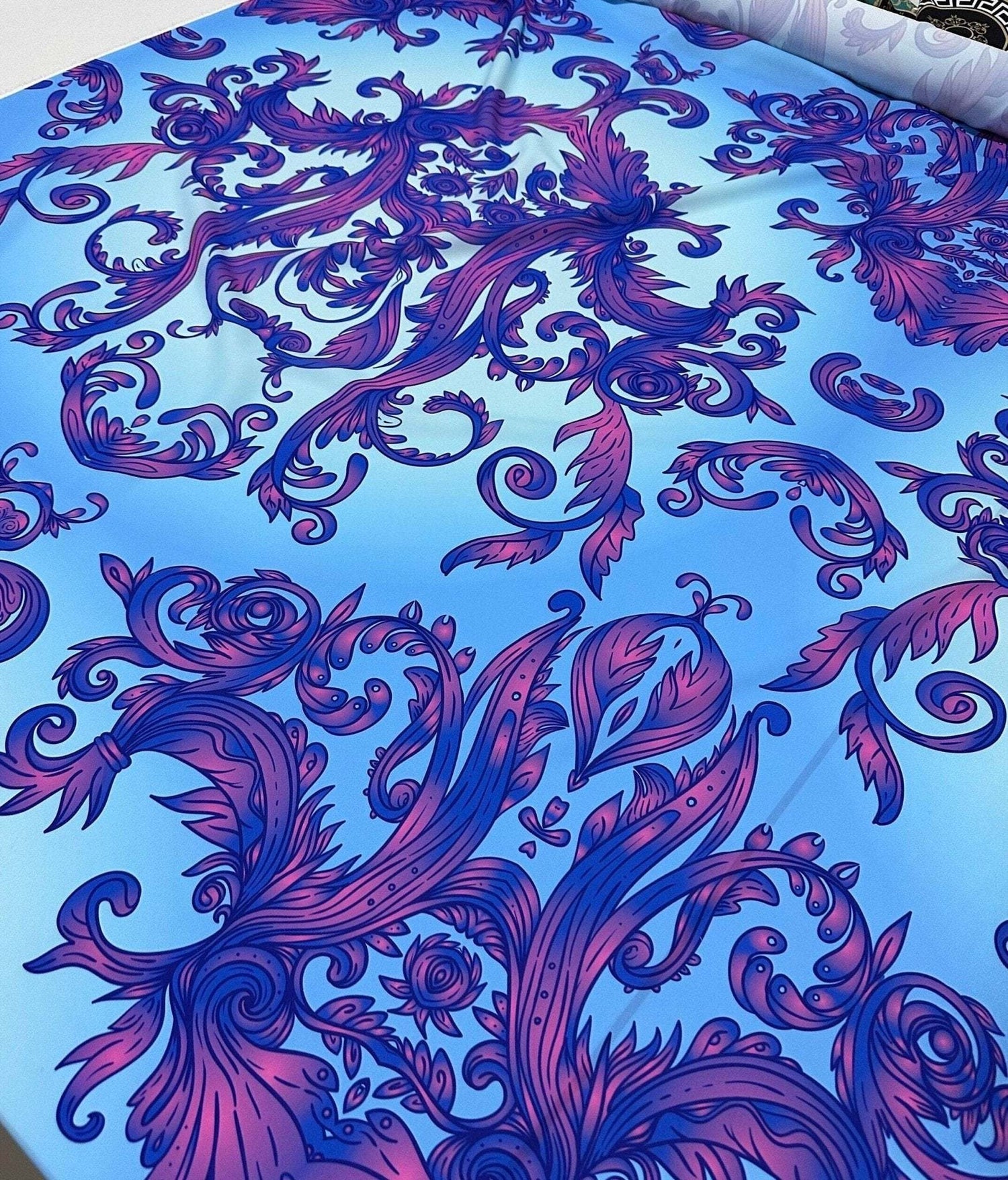 Purple and Blue Baroque Pattern Fabric with intricate floral and scroll designs on a vibrant blue background