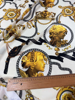 Queen and Rome Pattern crepe fabric with elegant gold and black classical motifs on white background, 150cm wide