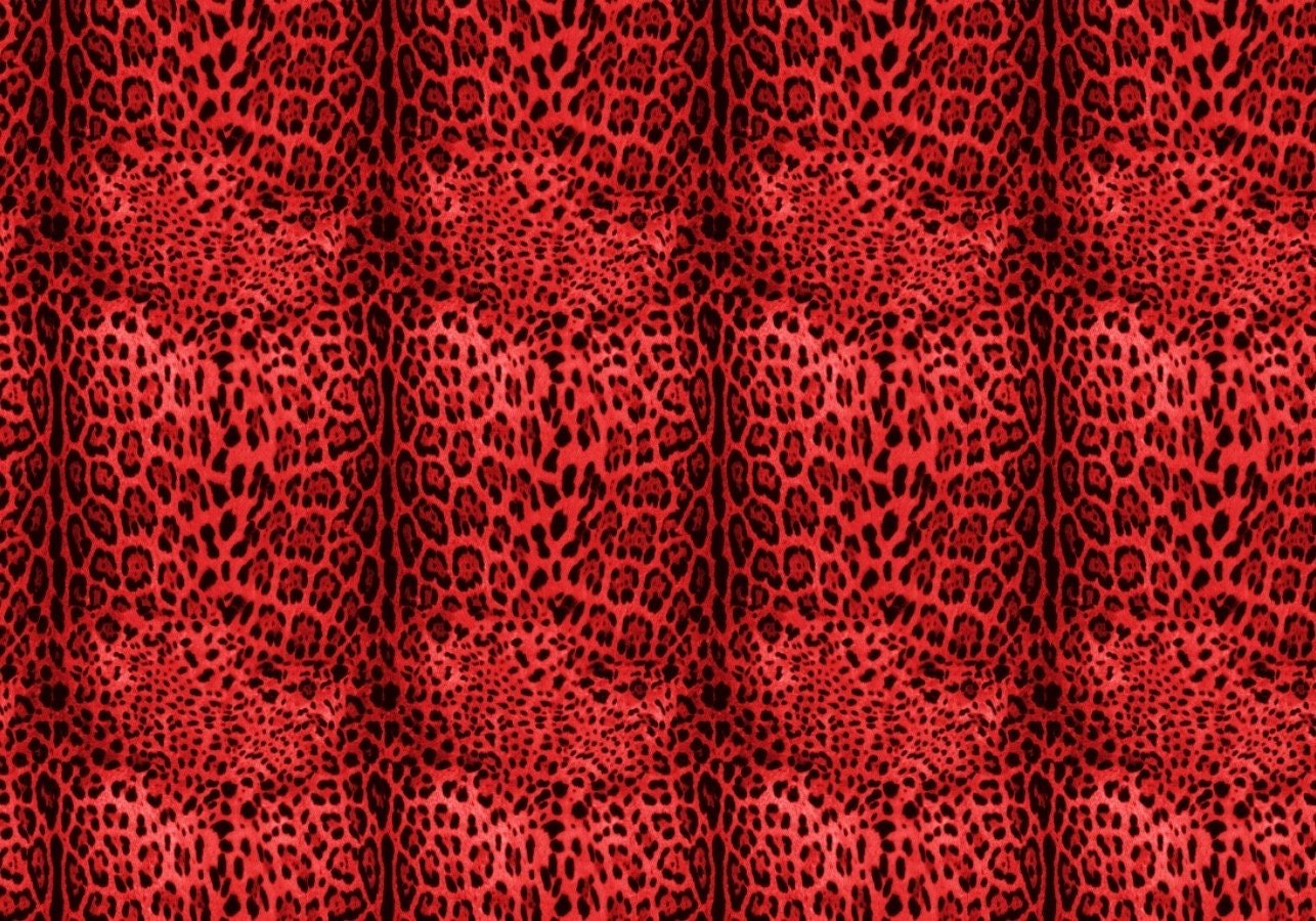 Red leopard print sequin fabric with 2-way stretch, vibrant and glamorous for sewing projects