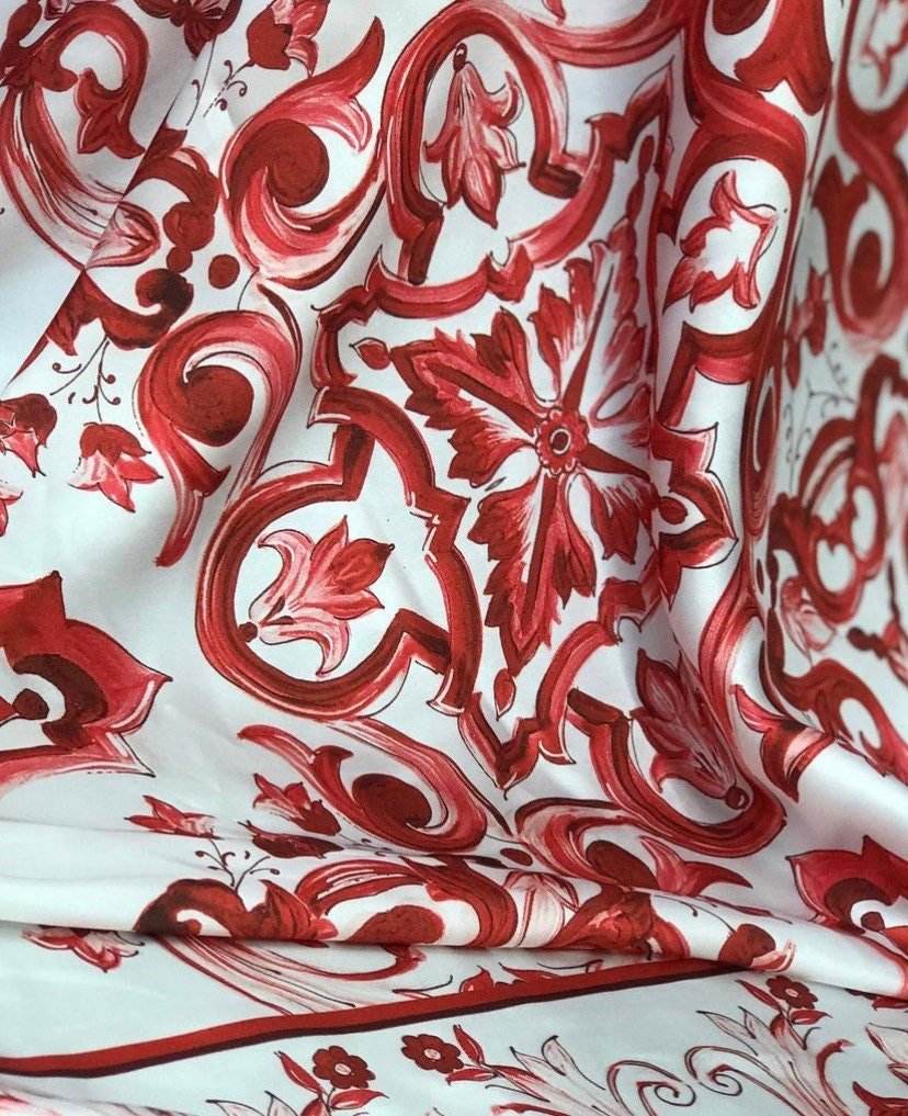 Red Majolica pattern fabric with intricate floral design in vibrant red tones on white background