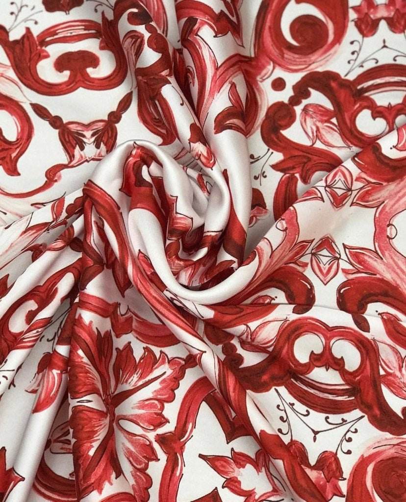 Red Majolica pattern fabric with floral design in rich red tones on white background