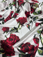White fabric with vibrant red rose pattern and green leaves, 150cm width, floral print material for sewing projects