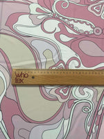 Retro pink abstract floral fabric with ruler showing scale and 150cm width