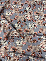 Romantic watercolor floral fabric with soft gray and blush tones and delicate flower patterns