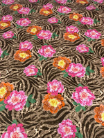 Rose Leopard Baroque Fabric with pink and orange floral patterns on a leopard and zebra print background