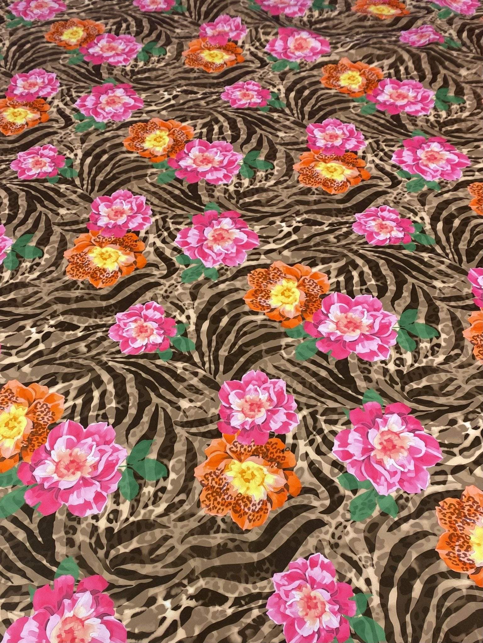 Rose Leopard Baroque Fabric with pink and orange floral patterns on a leopard and zebra print background
