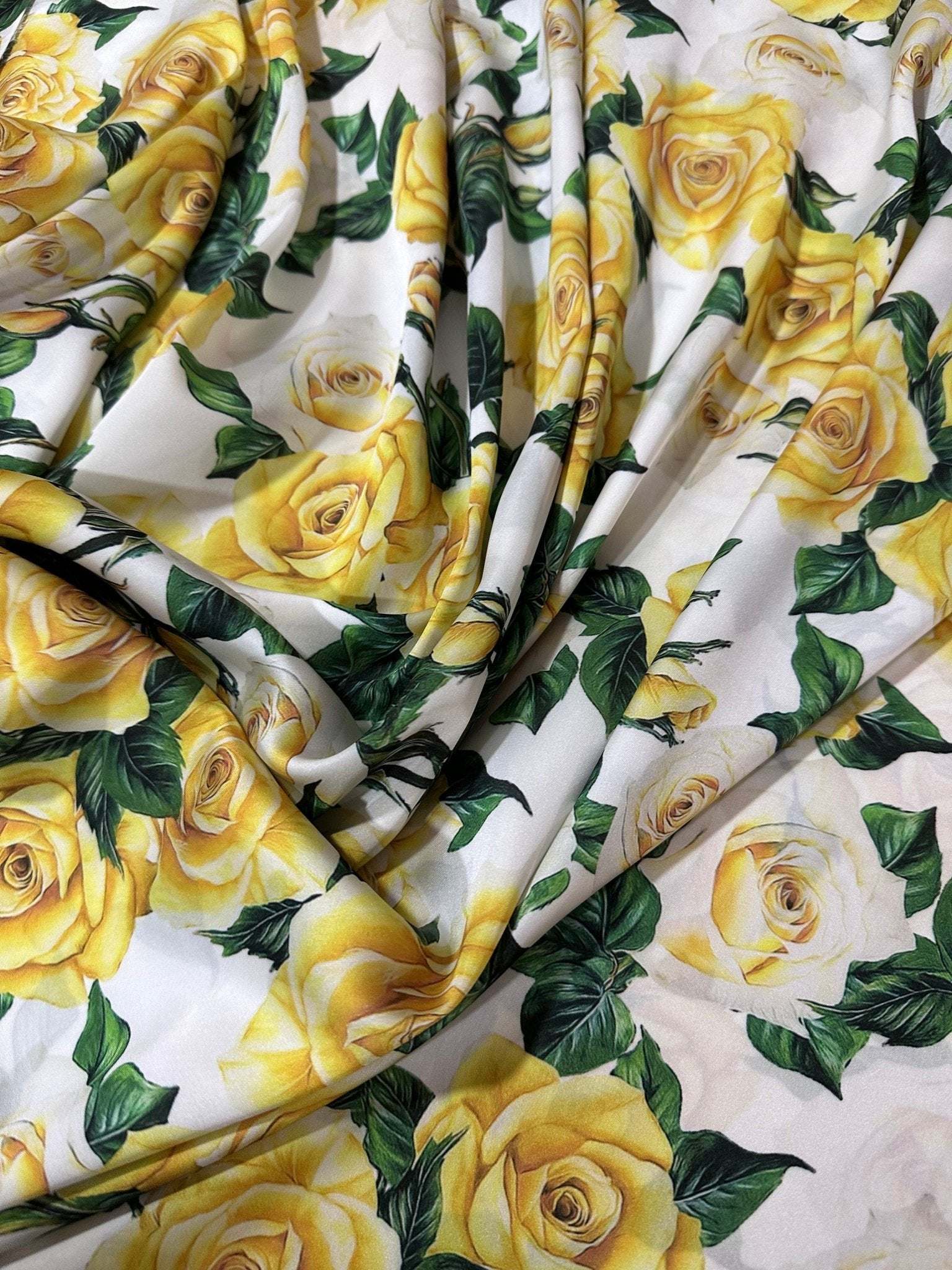 Yellow floral rose pattern fabric with green leaves on white background, 150cm wide textile for sewing and crafting projects